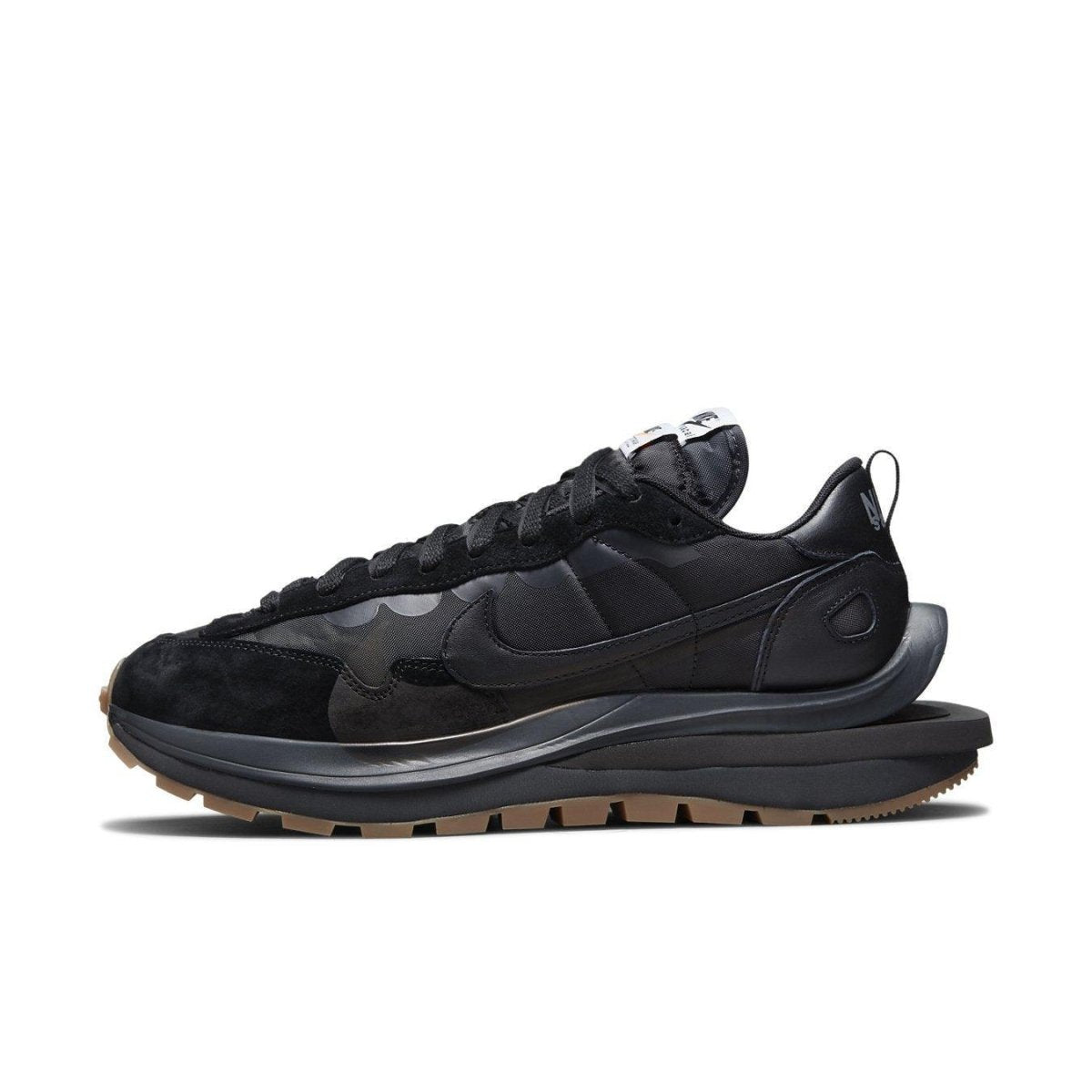 Nike Vaporwaffle sacai Black Gum shoe side view with black nylon, suede, and leather details.