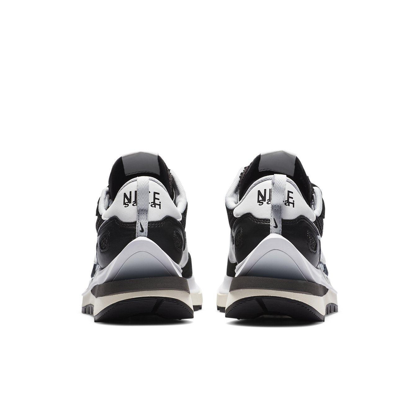 Nike VaporWaffle sacai Black White sneakers rear view showcasing modern design and iconic Waffle sole.