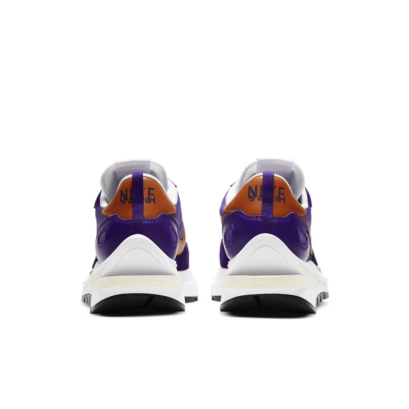 Nike VaporWaffle sacai Dark Iris back view showcasing purple nylon upper with orange accents and modern retro silhouette.