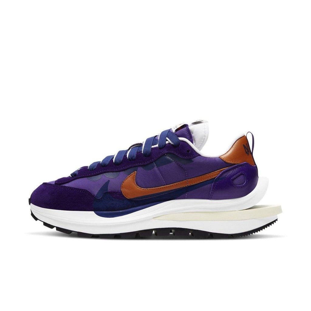 Nike VaporWaffle sacai Dark Iris sneakers in purple and burnt orange, blending retro style with modern design.