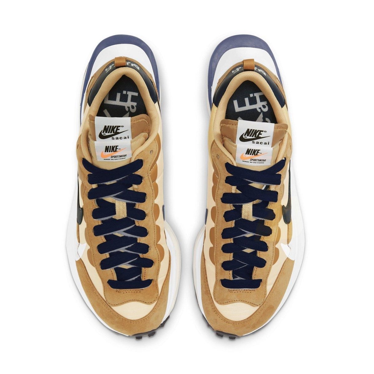 Nike x sacai VaporWaffle sneakers in Sesame and Blue Void, showcasing unique design and layered materials.