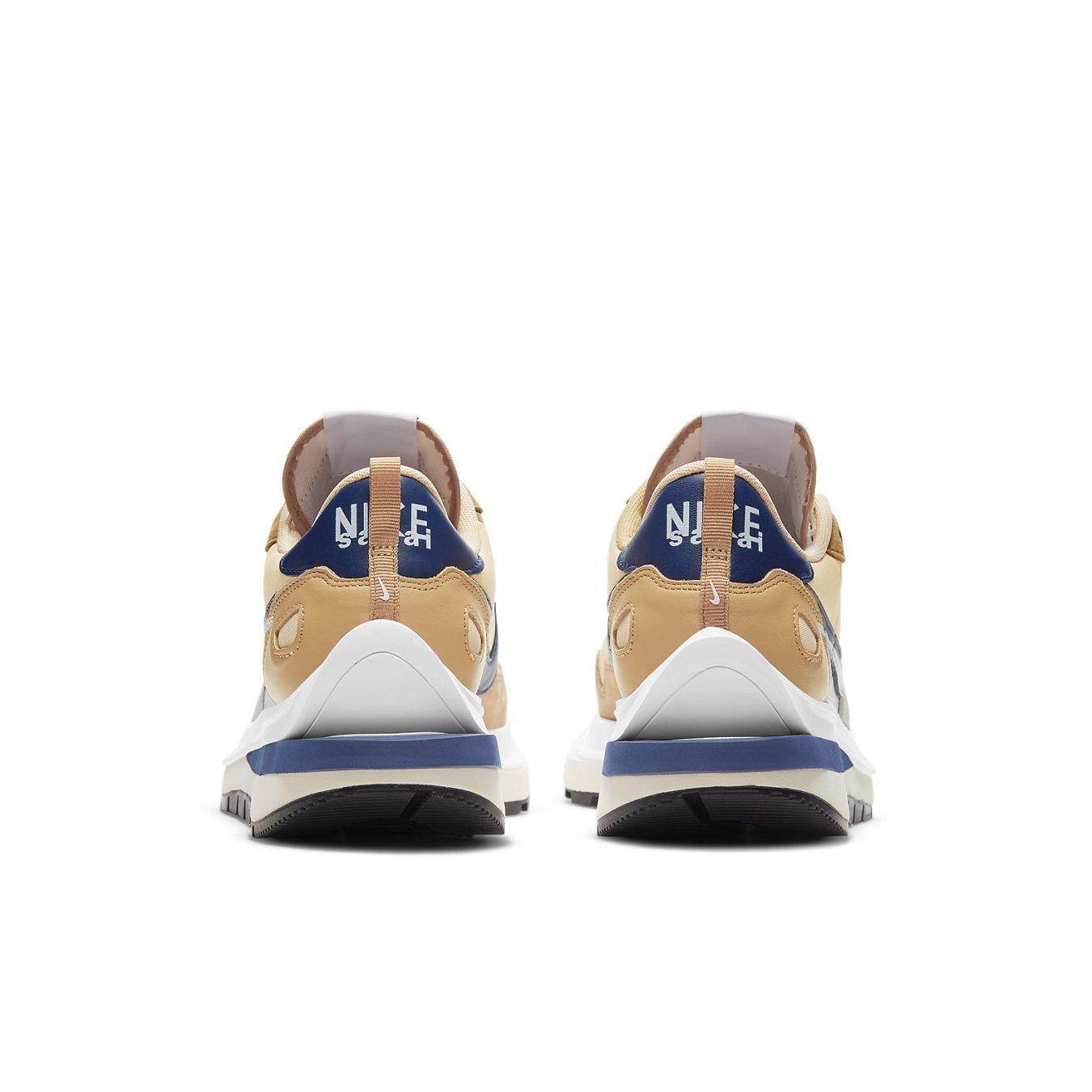 Nike VaporWaffle sacai Sesame Blue Void shoes rear view with distinctive Waffle outsole and unique colorway.
