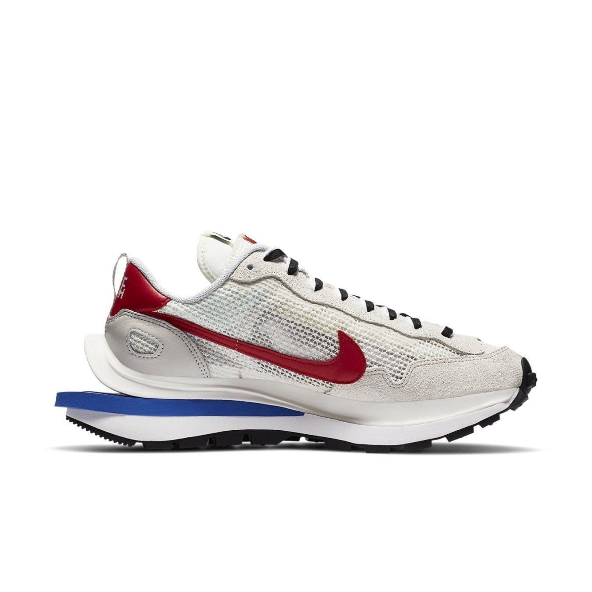 Nike x sacai VaporWaffle sneakers in white, red, and blue, blending modern and classic design elements for runners.