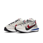 Nike Vaporwaffle sacai sneakers in fuchsia and royal, blending modern and classic styles for ultimate comfort.