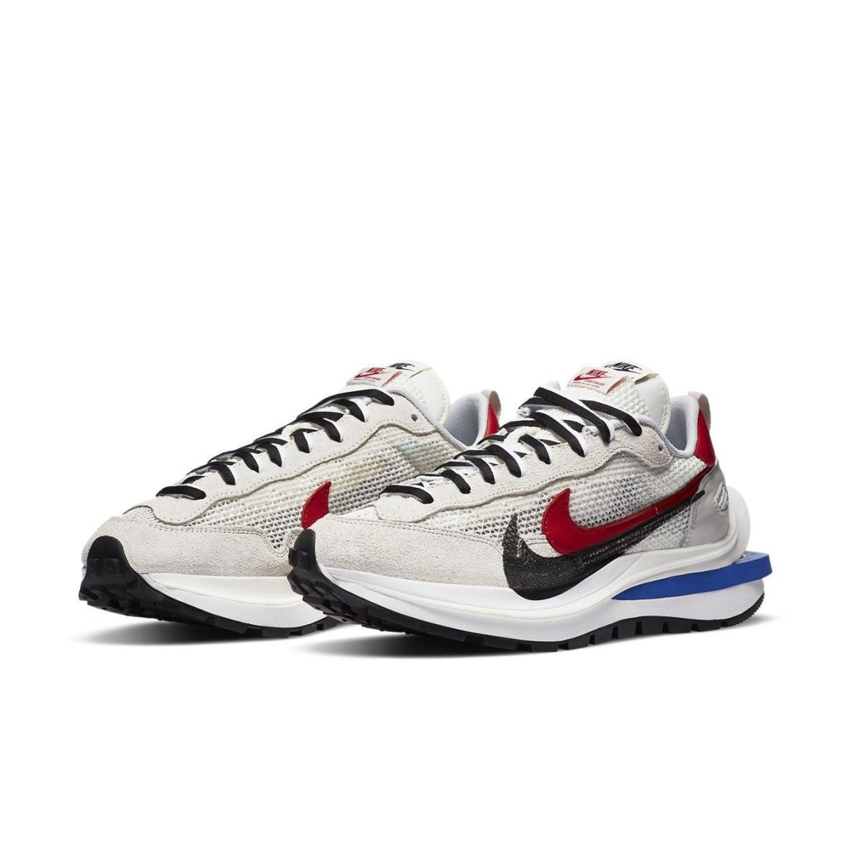 Nike Vaporwaffle sacai sneakers in fuchsia and royal, blending modern and classic styles for ultimate comfort.