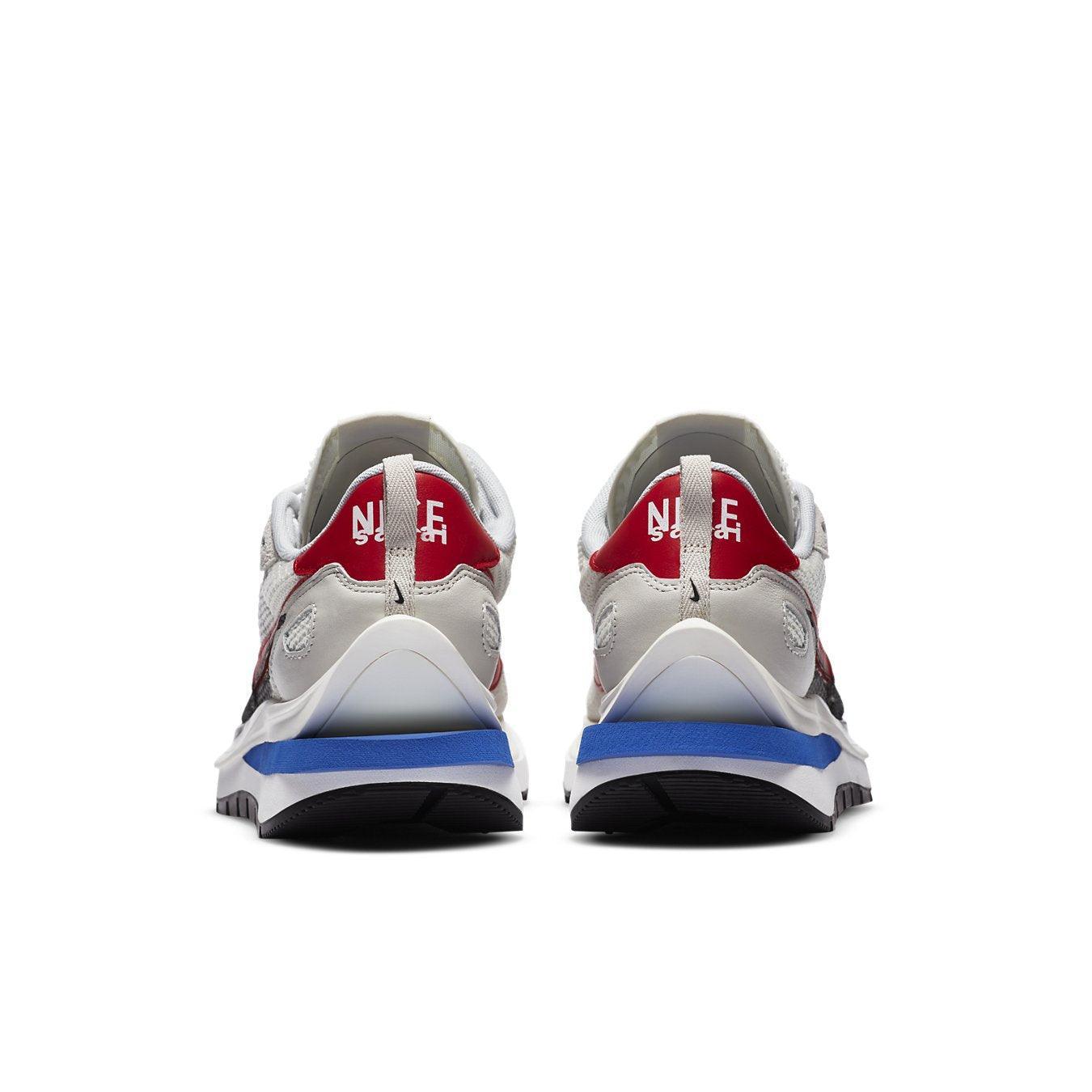 Nike Vaporwaffle sacai Sport shoes, back view showcasing Fuchsia and Game Royal colorway.