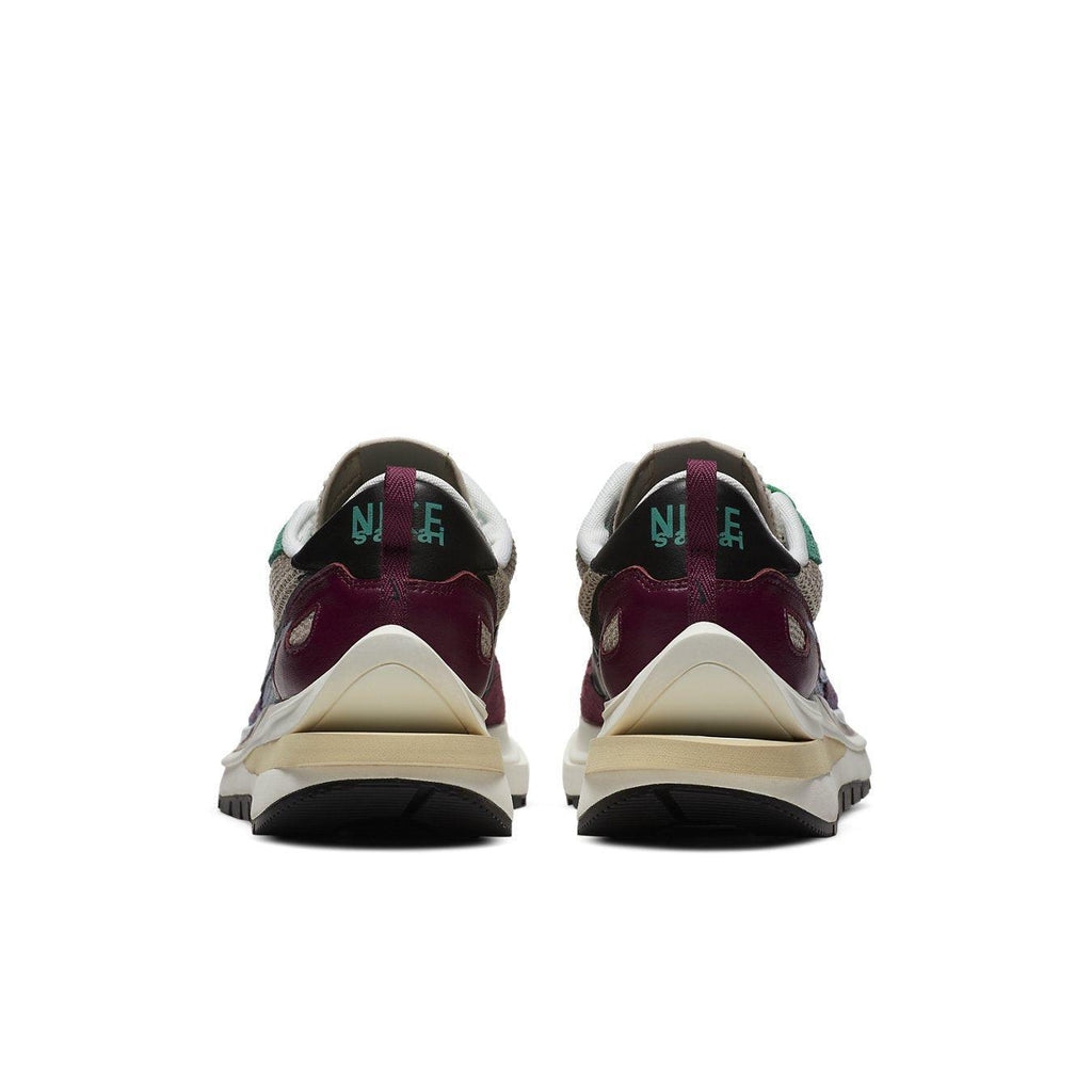 Nike Vaporwaffle sacai Villain Red Neptune Green sneakers rear view with distinctive color blend.