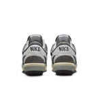 Nike Zoom Cortez SP sacai 'Iron Grey' sneakers featuring a layered design and neutral color palette from the back.