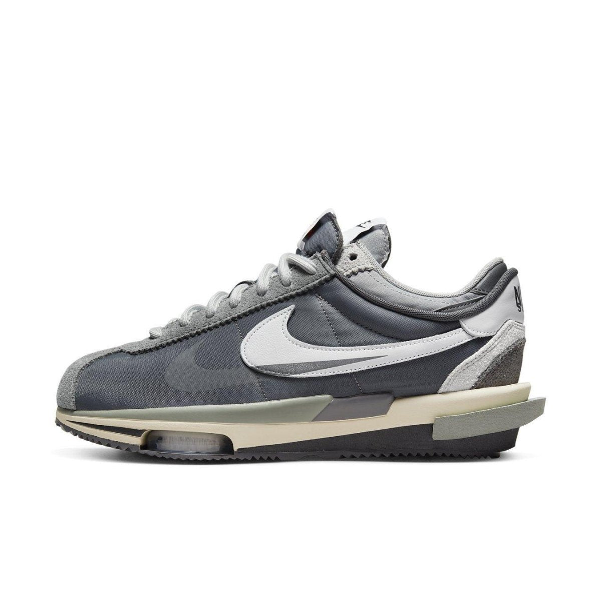 Nike Zoom Cortez SP sacai Iron Grey sneaker showcasing layered design and neutral tones.