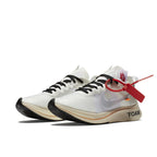 Nike Zoom Fly Off-White sneakers featuring white upper, black accents, and red zip tie detail.