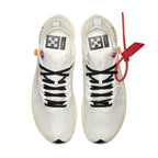 Nike Zoom Fly Off-White sneakers with white and black details, orange accents, and red zip tie.