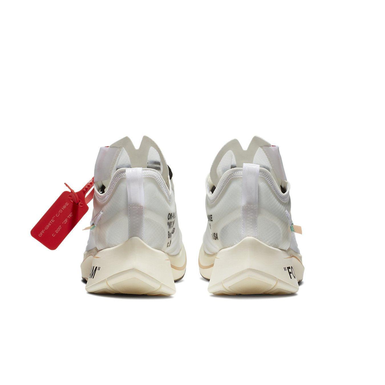 Nike Zoom Fly Off-White sneakers showcasing white upper, orange accents, and signature "FOAM" detail on the heel.