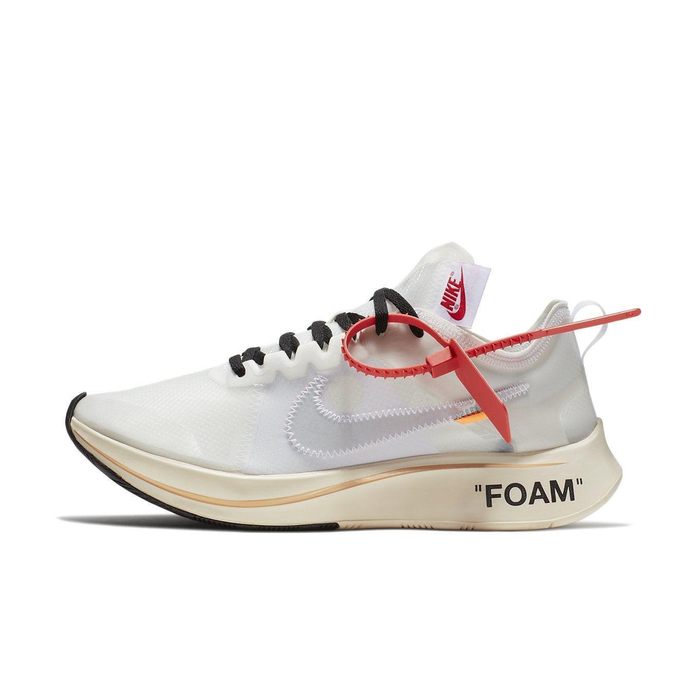Nike Zoom Fly Off-White sneakers featuring white upper, black Swoosh, orange accents, and red zip tie.