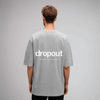 Oversized gray tee featuring bold Dropout logo on the back, showcasing relaxed streetwear style.